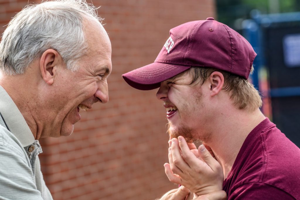 Two people looking at each other and smiling